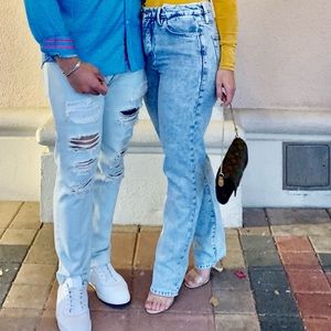 Good American high rise boyfriend fit jeans.